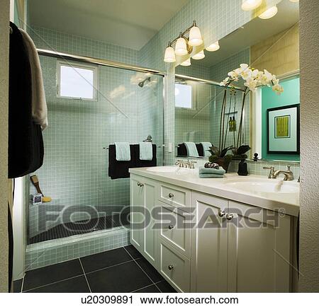 Stock Image - Elegant Blue Bathroom with White Orchids. Fotosearch