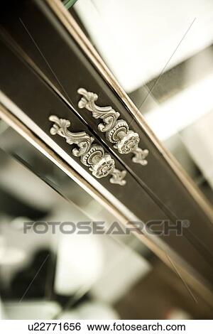 Elegant door knobs on china cabinet View Large Photo Image Stock Photograph - Elegant door knobs on china cabinet. Fotosearch