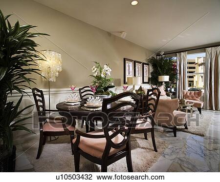 Stock Image - Elegant sitting and dining area with marble floor. Fotosearch