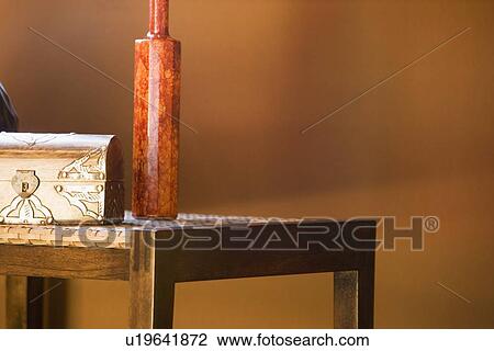 End table with decorative chest and vase on top View Large Photo Image Stock Image - End table with decorative chest and vase on top. Fotosearch