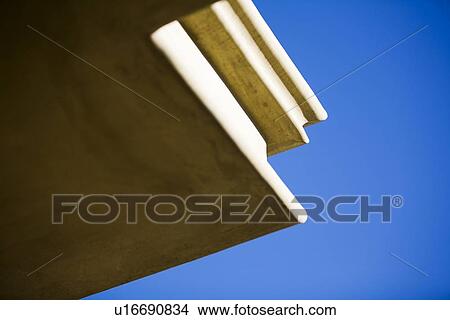 Exterior architectural detail against blue sky View Large Photo Image Picture - Exterior architectural detail against blue sky. Fotosearch