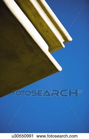 Exterior architectural detail against blue sky View Large Photo Image Stock Image - Exterior architectural detail against blue sky. Fotosearch