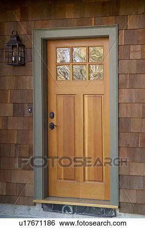 Exterior detail of spruce door on shingle style house View Large Photo Image Stock Photograph - Exterior detail of spruce door on shingle style house. Fotosearch