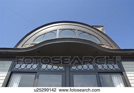 Exterior view of home with geometric windows View Large Photo Image Stock Image - Exterior view of home with geometric windows. Fotosearch