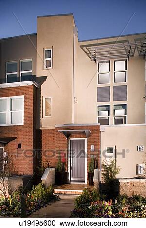 Stock Image - Exterior view of loft style homes. Fotosearch