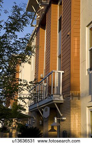 Stock Image - Front exterior contemporary loft style condos. Fotosearch
