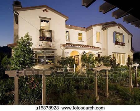 Front exterior Spanish style homes at dusk View Large Photo Image Stock Photo - Front exterior Spanish style homes at dusk. Fotosearch