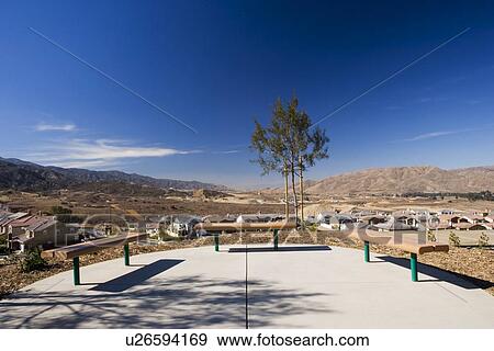 Stock Photo - Group of benches overlooking housing community. Fotosearch