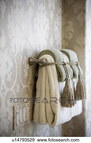 Handle towels on towel bar tied with tassels View Large Photo Image Stock Photo - Handle towels on towel bar tied with tassels. Fotosearch