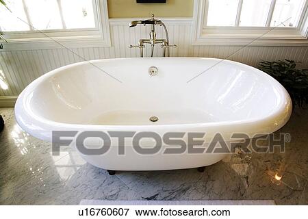Stock Photo - High angle view of freestanding bathtub. Fotosearch