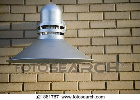 Stock Photo - industrial style exterior wall light on brick wall. Fotosearch