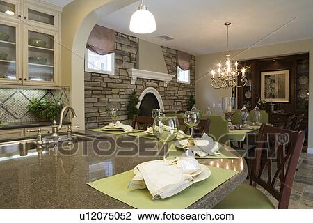 Kitchen with breakfast bar and dining room with stone wall View Large Photo Image Stock Image - Kitchen with breakfast bar and dining room with stone wall. Fotosearch