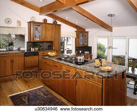 Stock Photograph - Kitchen with hardwood floor and pitched ceiling. Fotosearch
