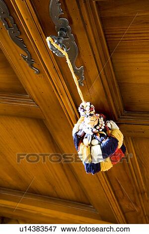 Large colorful tassel hanging on handle of cabinet View Large Photo Image Stock Photo - Large colorful tassel hanging on handle of cabinet. Fotosearch