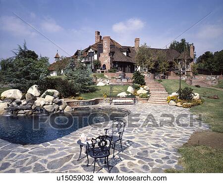 Large cottage with pond and stone walkway View Large Photo Image Stock Image - Large cottage with pond and stone walkway. Fotosearch