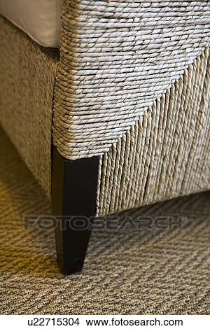 Leg of wooden and raffia chair on rug View Large Photo Image Picture - Leg of wooden and raffia chair on rug. Fotosearch