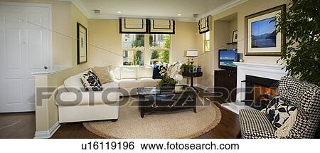 Living room with sectional sofa and circular area rug, panoramic View Large Photo Image Stock Photograph - Living room with sectional sofa and circular area rug, panoramic. Fotosearch