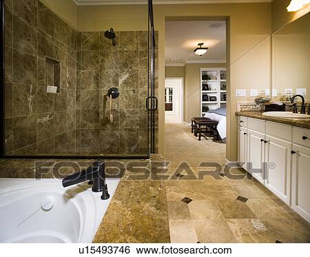Master bathroom with large tub and glass shower View Large Photo Image Stock Photograph - Master bathroom with large tub and glass shower. Fotosearch
