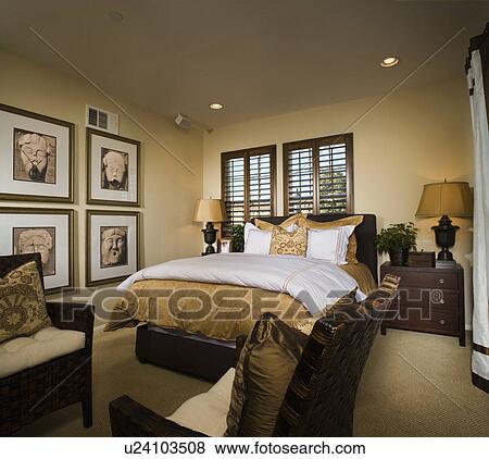 Master bedroom with gold and brown accents View Large Photo Image Stock Photo - Master bedroom with gold and brown accents. Fotosearch