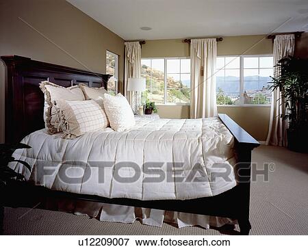 Master bedroom with large bed View Large Photo Image Stock Photo - Master bedroom with large bed. Fotosearch