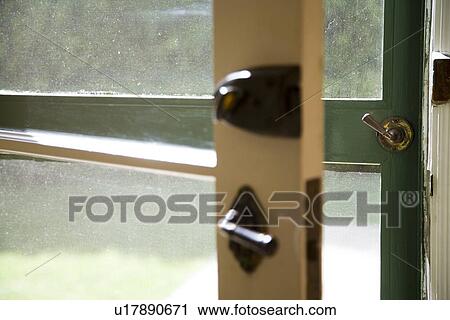 Opened old door and green screen door View Large Photo Image Stock Image - Opened old door and green screen door. Fotosearch