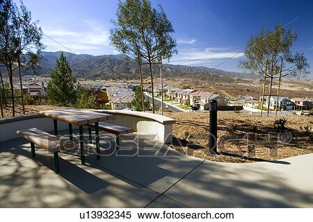 Picnic table overlooking contemporary housing community View Large Photo Image Stock Photography - Picnic table overlooking contemporary housing community. Fotosearch
