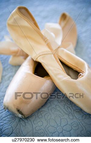 Pink ballet slippers on blue bedspread View Large Photo Image Stock Image - Pink ballet slippers on blue bedspread. Fotosearch