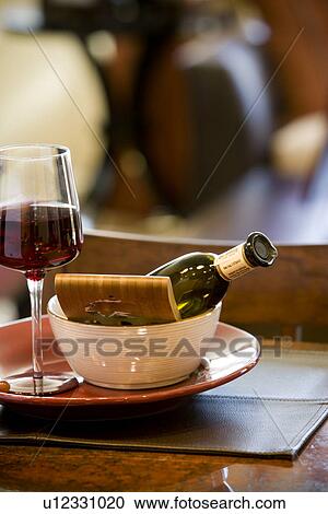 Stock Image - Place setting with bowl plate and wine glass. Fotosearch