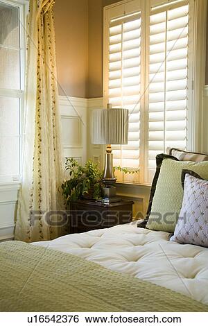 Purple and green decorative pillows on bed near window View Large Photo Image Stock Photograph - Purple and green decorative pillows on bed near window. Fotosearch