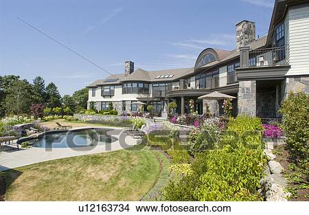 Rear exterior large neo eclectic home with swimming pool View Large Photo Image Picture - Rear exterior large neo eclectic home with swimming pool. Fotosearch