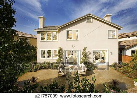 Rear exterior of traditional home with cross gable roof View Large Photo Image Stock Photo - Rear exterior of traditional home with cross gable roof. Fotosearch