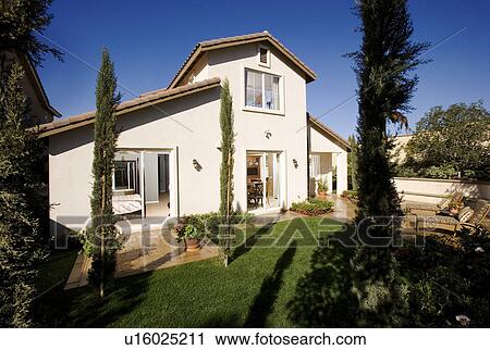 Rear exterior traditional multiple story home View Large Photo Image Stock Image - Rear exterior traditional multiple story home. Fotosearch