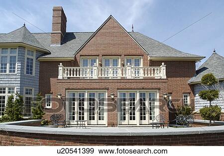 Stock Photo - Rear exterior traditional neo eclectic home. Fotosearch