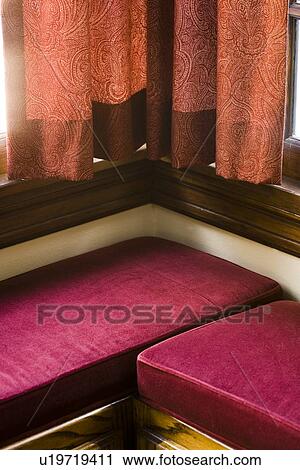 Red velvet cushions on benches near window View Large Photo Image Stock Image - Red velvet cushions on benches near window. Fotosearch