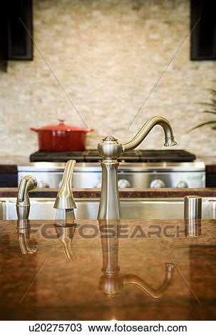 Reflection Of Kitchen Faucet On Granite Countertop Stock Image