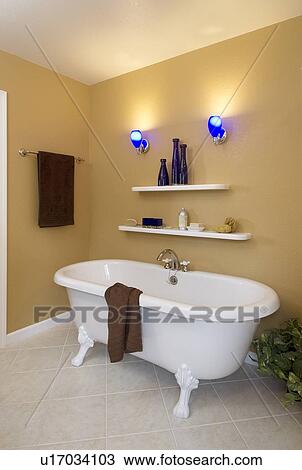 Stock Image - Residential bath with claw foot tub. Fotosearch