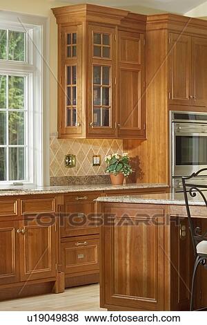 Section of large kitchen with wooden cabinetry View Large Photo Image Stock Photo - Section of large kitchen with wooden cabinetry. Fotosearch