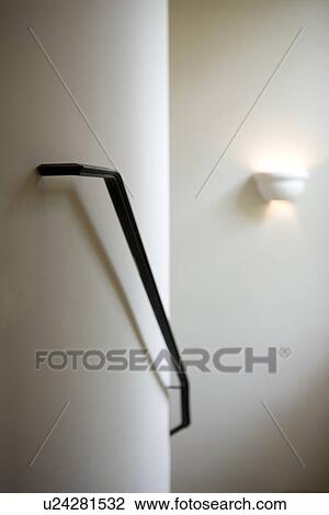 Stock Image - Simple black stairway railing. Fotosearch