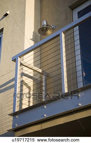 Small balcony off side of contemporary loft style condo View Large Photo Image Stock Photography - Small balcony off side of contemporary loft style condo. Fotosearch