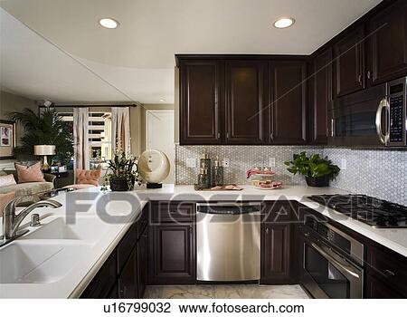 Sophisticated kitchen with tile backsplash View Large Photo Image Stock Image - Sophisticated kitchen with tile backsplash. Fotosearch