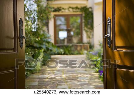 Stone path leading into Spanish style courtyard with fountain. View Large Photo Image Stock Image - Stone path leading into Spanish style courtyard with fountain.. Fotosearch