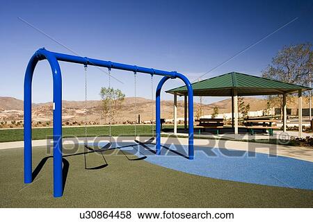 Swing set and picnic pavilion at contemporary playground View Large Photo Image Stock Photo - Swing set and picnic pavilion at contemporary playground. Fotosearch