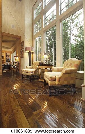 Two armchairs in front of large picture windows View Large Photo Image Stock Photography - Two armchairs in front of large picture windows. Fotosearch