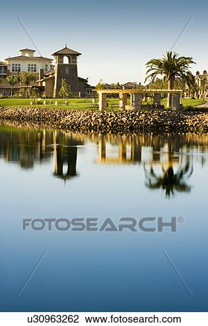Stock Image - View of contemporary housing community from across channel. Fotosearch