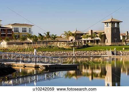 View of contemporary housing community from across channel View Large Photo Image Stock Photo - View of contemporary housing community from across channel. Fotosearch