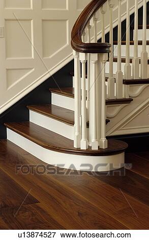 Stock Photo - Walnut staircase and hardwood floors. Fotosearch