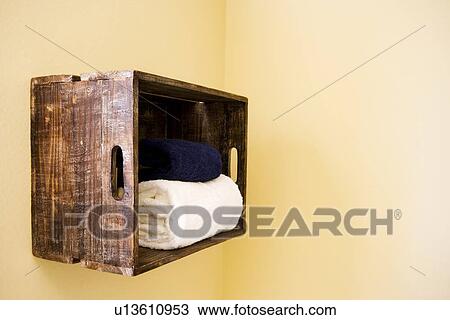 Wooden crate hung on wall to store bath towels View Large Photo Image Stock Image - Wooden crate hung on wall to store bath towels. Fotosearch