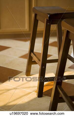 Wooden stools on tile floor View Large Photo Image Stock Image - Wooden stools on tile floor. Fotosearch