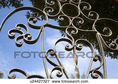 Wrought iron gate with cobwebs View Large Photo Image Stock Photo - Wrought iron gate with cobwebs. Fotosearch