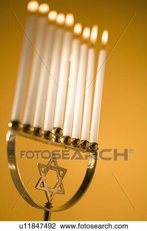 Stock Image - A fully lit menorah. Fotosearch